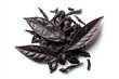 © Bumbu - Dark, oxidized tea leaves, some whole, others fragmented, arranged on a stark white background; overhead shot