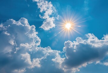 Wall Mural - A bright sunburst shines through a vibrant blue sky dotted with puffy, white cumulus clouds, casting a warm glow