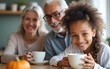 © Maria - Happy smiling senior parents with adult daughter drinking tea. High quality