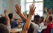 © Ruth - Children raising hands in classroom. High quality