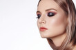 © marinafrost - Beautiful Woman with an Fashion Hairstyle and Creative Makeup. Beauty face with trendy Make-up