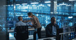 © Gorodenkoff - Modern Office in a Server Facility: Female Data Scientist and Male Cybersecurity Expert Analyze Data Together on a Desktop Computer, Brainstorming New Security Solutions and Services