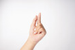 © AndhikaRaya - A hand with the index finger pointed outward is displayed on a white background