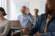 © ReeldealHD images - Engaged adult student raising his hand in class