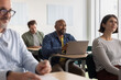 © ReeldealHD images - Student listening to an adult education course