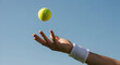 © Nur - Tennis player hand tossing ball up high blue sky background sports game competition training exercise fitness activity healthy lifestyle summer outdoor activity vibrant energy