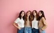 © Susan - Women friends isolated over pink wall background posing. High quality