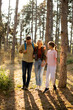 © BGStock72 - Family enjoys a pleasant hike through a sunny forest during the afternoon, creating lasting memories together