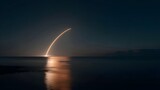 Rocket launch illuminates the night sky over calm waters in a spectacular display of technology and power