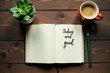 © Татьяна Антоненко - An open notebook with Enjoy the good written, next to a coffee cup and a small plant on a wooden table.