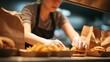© Johannes - young woman preparing take away fast food during coronavirus outbreak  focus on hands no logos no brands ar 169