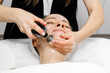 © Diana - Caucasian woman receiving RF lifting treatment for facial rejuvenation, relaxing on treatment table, with soothing ambiance and professional care in a modern spa environment