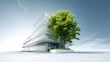 © Keo - A modern office building with a large green tree in front, set against a clear blue sky.