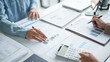 © Charlie's - business man Auditor or internal revenue service staff checking annual financial statements company Audit  Accounting tax.