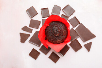Wall Mural - Tasty chocolate muffin on white marble background