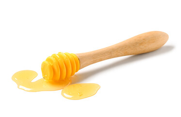 Wall Mural - Dipper with spilled tasty honey isolated on white background