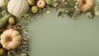 © Lew - A minimalistic green background board adorned with pumpkins, eucalyptus leaves,