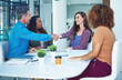 © peopleimages.com - Happy, business people and meeting with handshake for deal or project agreement together in office. Team, employees or shaking hands with group for partnership, b2b or collaboration in workplace