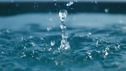 Wall Mural - Powerful slow motion water splash with clear, crystalline droplets exploding upwards, filmed with a cinematic high-speed camera action, nature, fluid