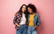 © shuai - Close up photo two cheer diversity she her ladies different race hands arms pockets hugging posing on camera good mood wear casual jeans denim checkered shirt cloth outfit isolated pink background