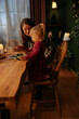 © bernardbodo - Mother and daughter preparing christmas dinner together