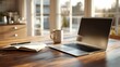 © imagemir - A serene workspace featuring a laptop, notebook, and coffee mug, basking in soft natural light.