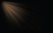© DreamStock - Golden sunbeams piercing through darkness creating a dramatic ethereal light effect on a black background