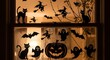 © SyedZubal - Spooky halloween window decorations with black cats bats ghosts and witches