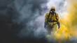 © Bussakon - Person in a yellow hazmat suit walks through dense colored smoke and dust conveying a sense of danger and environmental hazard