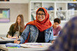 © Rido - Portrait of smiling muslim teen student at school