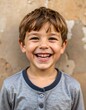 © Cecem - A happy young boy with short brown hair beams at the camera