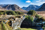 bridge over the river in mountains. located at Dunlewy in County Donegal, Ireland. this wintery sun image is known locally as the Poison Glen