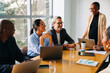© (JLco) Julia Amaral - Diverse colleagues gathered around a table during a professional meeting