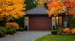 © BingiTingi - Garage door in luxury house with trees and nice landscape in Fall in Vancouver, Canada, North America. Day time on November 2024.