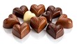 © Langka - Heart-shaped chocolates in varied hues clustered together on a reflective white surface