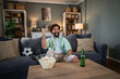 © Migma_Agency - Excited man celebrating soccer win while betting at home
