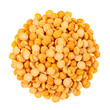 © coki - A high-angle, close-up view of a vibrant collection of dried split peas, arranged in a circular mound against a pure black background.