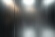 © Liliya - Close-up view of a vertically brushed metallic surface with a subtle gradient of light and reflections creating a sleek, industrial aesthetic