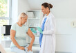 © Pixel-Shot - Female doctor vaccinating senior woman in clinic
