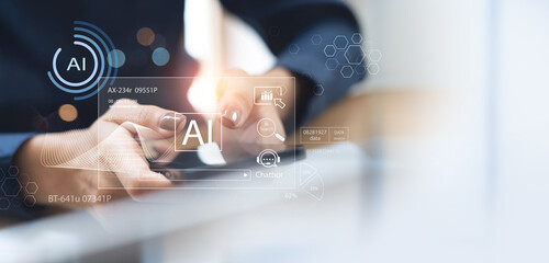 AI Artificial Intelligence. Business woman using AI technology for data analysis, coding computer language with machine learning on virtual screen, business intelligence