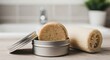 © Kamal - Solid shampoo bar in a tin with a loofah, showcasing sustainable personal care, eco-friendly bath products, and zero-waste living in an environmentally conscious bathroom setting.