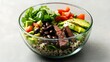 © MaM AL - Healthy steak and quinoa bowl with avocado, black beans, tomatoes, and cilantro