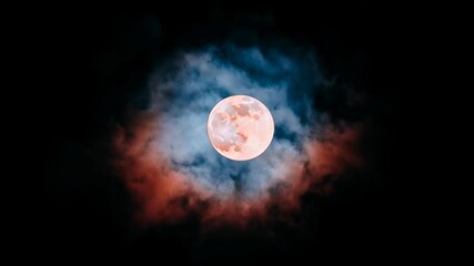 Wall Mural - Large red moon is in the center of a cloudy sky. The sky is dark and the moon is the only bright object in the scene