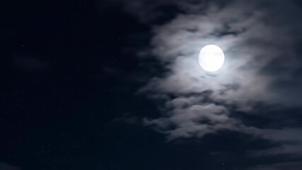Wall Mural - Ethereal timelapse of the full moon gracefully traversing the night sky amidst light cloud cover astrophotography, gracefully traversing, full moon