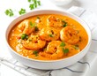 © supri - Creamy orange shrimp curry in a white bowl (1)