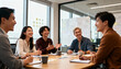 © Miriam - Happy diverse asian business team brainstorming ideas in a modern office. Successful creative colleagues in a corporate meeting. Teamwork, collaboration and communication concept.