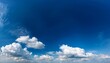 © Alan - clear sky with wandering clouds free in the vault of heaven against the deep blue sky white clouds float leisurely they vary in size and gather or disperse freely creating a pure and relaxed scen