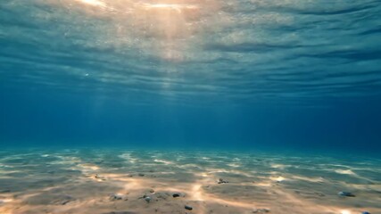 Wall Mural - Underwater view with sun rays filtering through the surface as gentle waves pass peaceful, gentle waves, outdoor