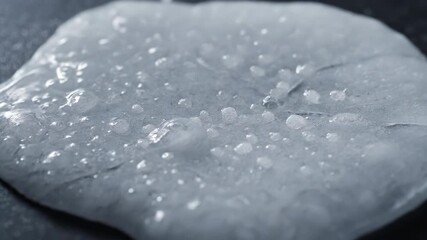 Wall Mural - Timelapse showing an icy crust forming and thickening on a cold surface from hail timelapse, outdoor, surface