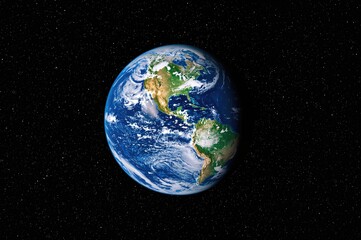 Wall Mural - Stunning view of the blue globe showing oceans, clouds, and landmasses floating in the cosmic starfield.
